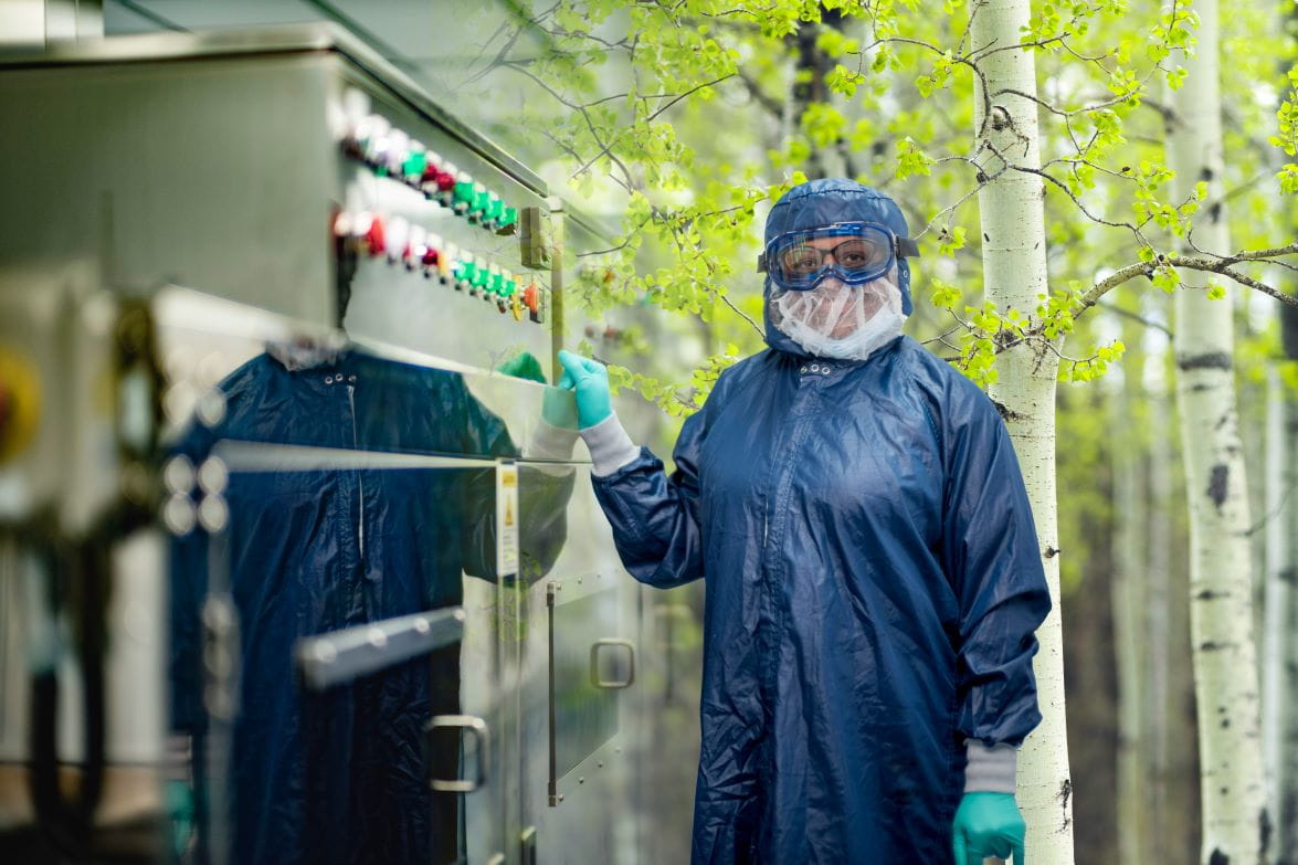 Woman standing in front of forest