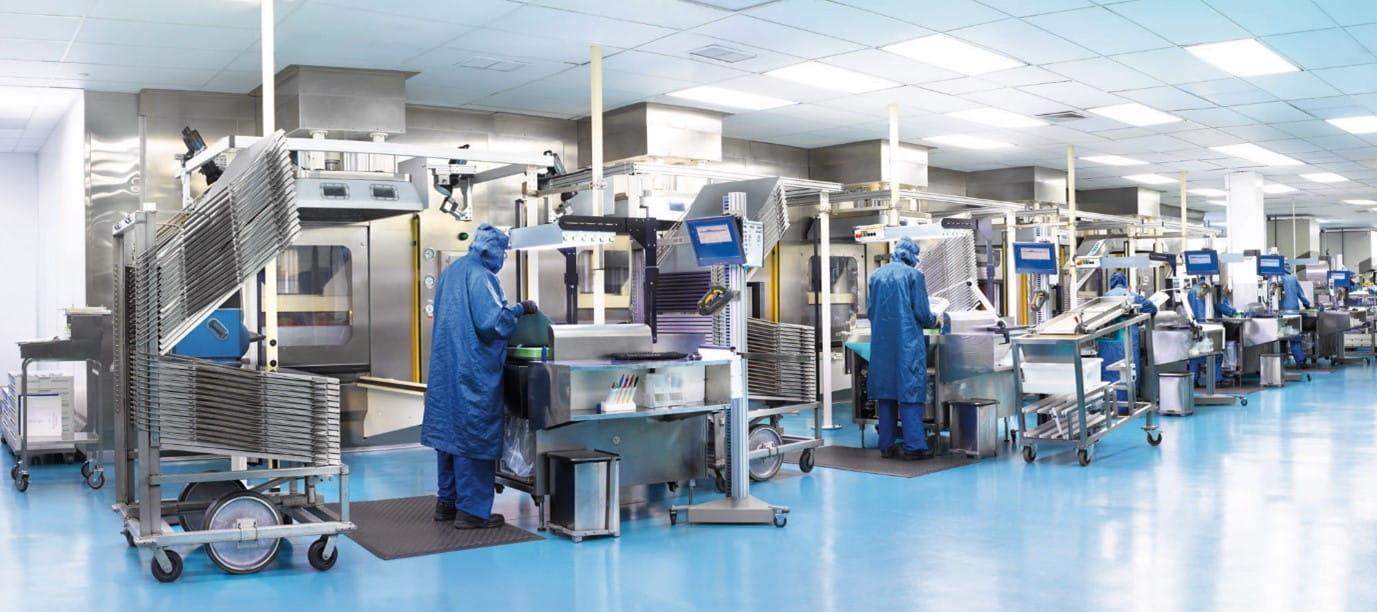 Scientist enhancing EU GMP Annex 1 compliance in pharma lab