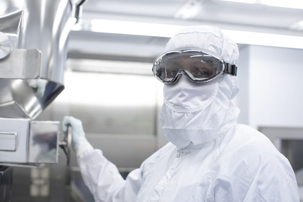 West scientist working in a sterile cleanroom ensuring Annex 1 compliance in pharmaceutical manufacturing